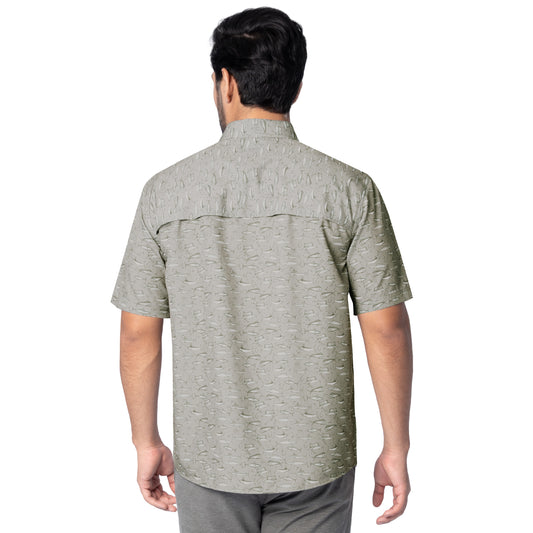 Man wearing a patterned gray shirt on a white background