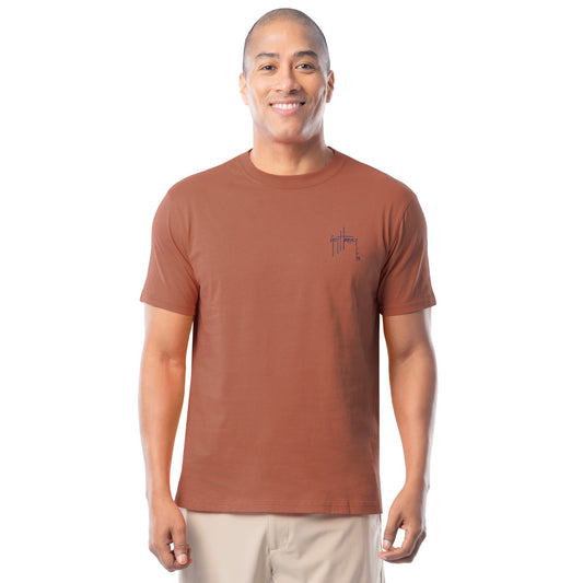 Man wearing a orange t-shirt with a Guy Harvey on a white background