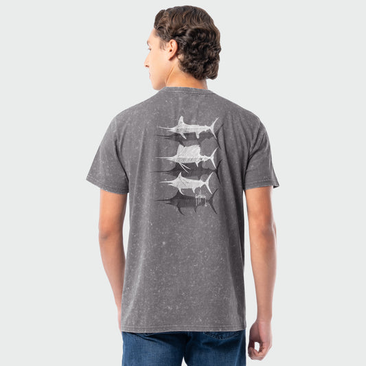 Person wearing a gray washed t-shirt with billfish illustrations on the back against a white background
