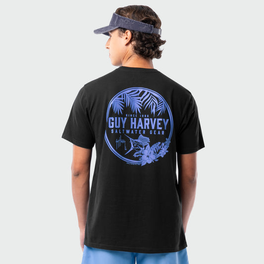 Person wearing a black Guy Harvey t-shirt with a blue palms graphic and marlin on the back.