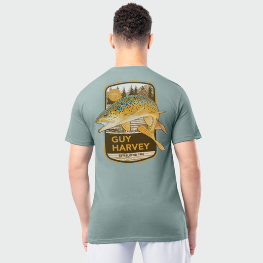 Person wearing a Guy Harvey t-shirt with a trout fish graphic on the back