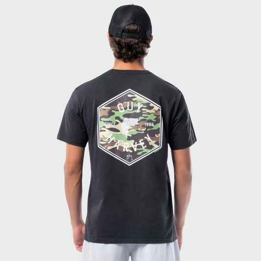 Person wearing a black t-shirt with a camouflage logo on the back against a white background