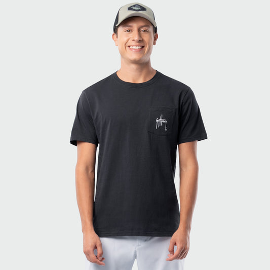 Man wearing a black t-shirt with a logo on a light gray background