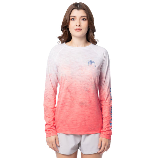 Woman wearing a long-sleeve shirt with a gradient design on a white background