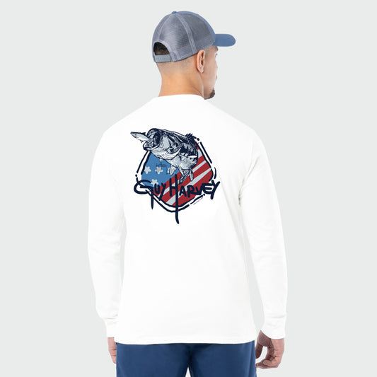 Man wearing a white long-sleeve shirt with a bass graphic design on the back, standing against a light gray background.