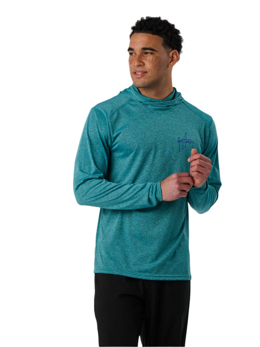 Man wearing a teal athletic hoodie with a logo on a white background