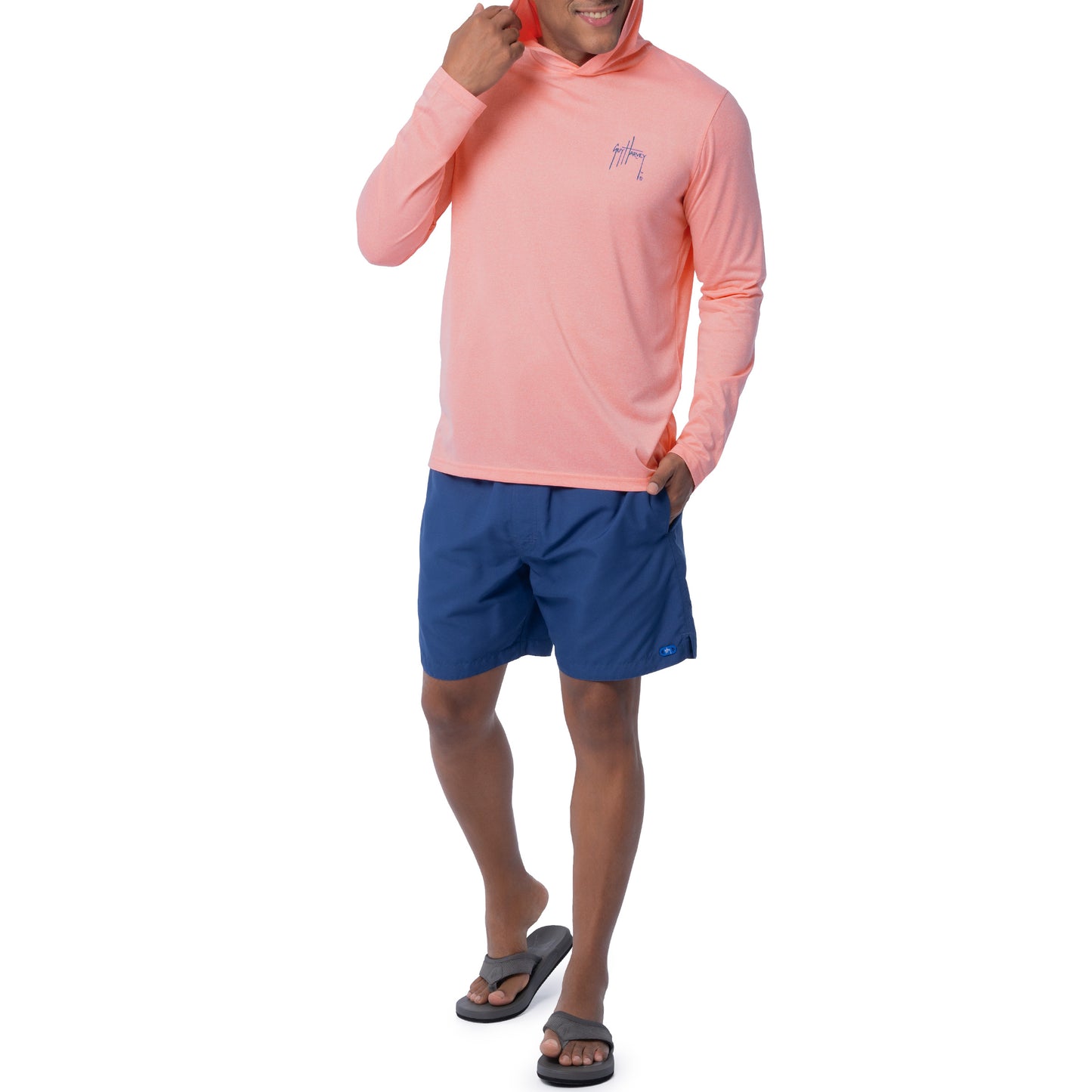 Model wearing Guy Harvey Men's Boxed Mahi Performance Fishing Hoodie.