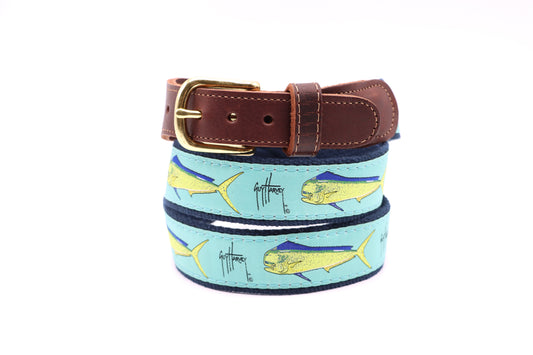 Guy Harvey Men’s Bull Dolphin Leather Tab Belt with aqua cotton webbing, yellow and blue mahi-mahi artwork, brown leather tabs, and brass buckle.