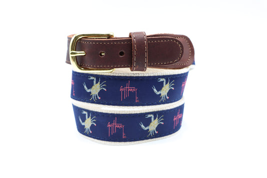 Guy Harvey Men’s Crab on Navy Leather Tab Belt with navy cotton webbing, yellow crab motifs, red signature logo, brown leather tabs, and brass buckle.