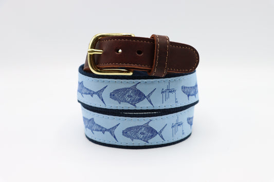 Guy Harvey Men’s Keys Slam Leather Tab Belt with light blue cotton webbing featuring tarpon, bonefish, and permit art, brown leather tabs, and brass buckle