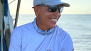 Keishmer Hermoso smiling on a boat