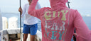 A kid wearing Guy Harvey Eco Cast Sun Protection Hood