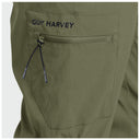 Close-up of olive green outdoor pants showing a zippered pocket with the brand name GUY HARVEY in black above it.