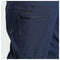 Close-up of navy blue fishing pants showing a zippered pocket with the brand name 'GUY HARVEY' in black on the pocket flap.