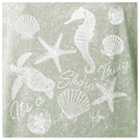 A square graphic print featuring white sea-themed illustrations including a seahorse, turtle, starfish, and shells over a distressed sage green background, with the text 'It's a Shore Thing' and a visible 'Guy Harvey' brand signature.