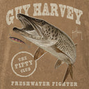 Vintage-style illustrated graphic featuring a large northern pike fish with open mouth, a small fishing lure, and distressed text reading 'GUY HARVEY', 'THE FIFTY CLUB', and 'FRESHWATER FIGHTER' on a brown textured background.