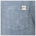Close-up of a textured blue-gray pocket with a small beige brand tag reading 'Guy Harvey' on a matching fabric background.