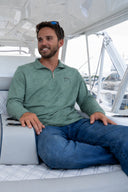 Man wearing a Green Guy Harvey Coastal Classic Quarter Zip