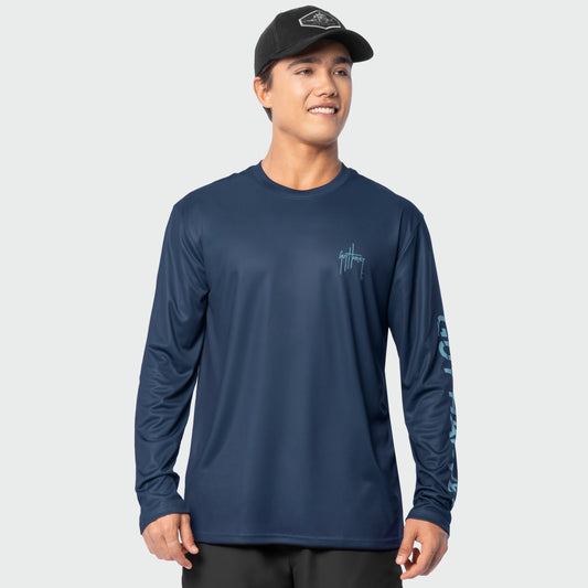 Man wearing a navy long-sleeve shirt with Guy Harvey branding on a light gray background