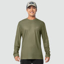 Man wearing an olive green long-sleeve shirt and cap on a light gray background