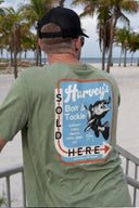 Man wearing a Olive Green Threadcycled Guy Harvey T-Shirt