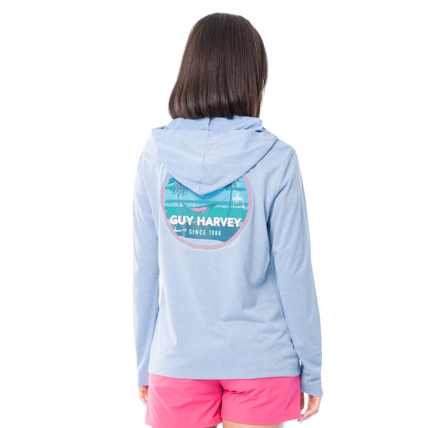Person wearing a light blue hoodie with Guy Harvey logo on the back, standing against a white background.