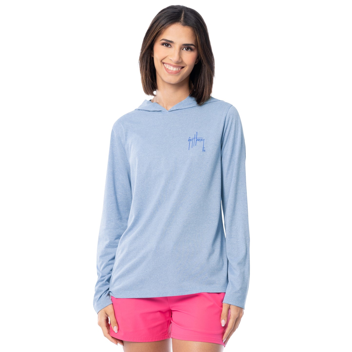 Woman wearing a light blue hoodie and pink shorts on a white background