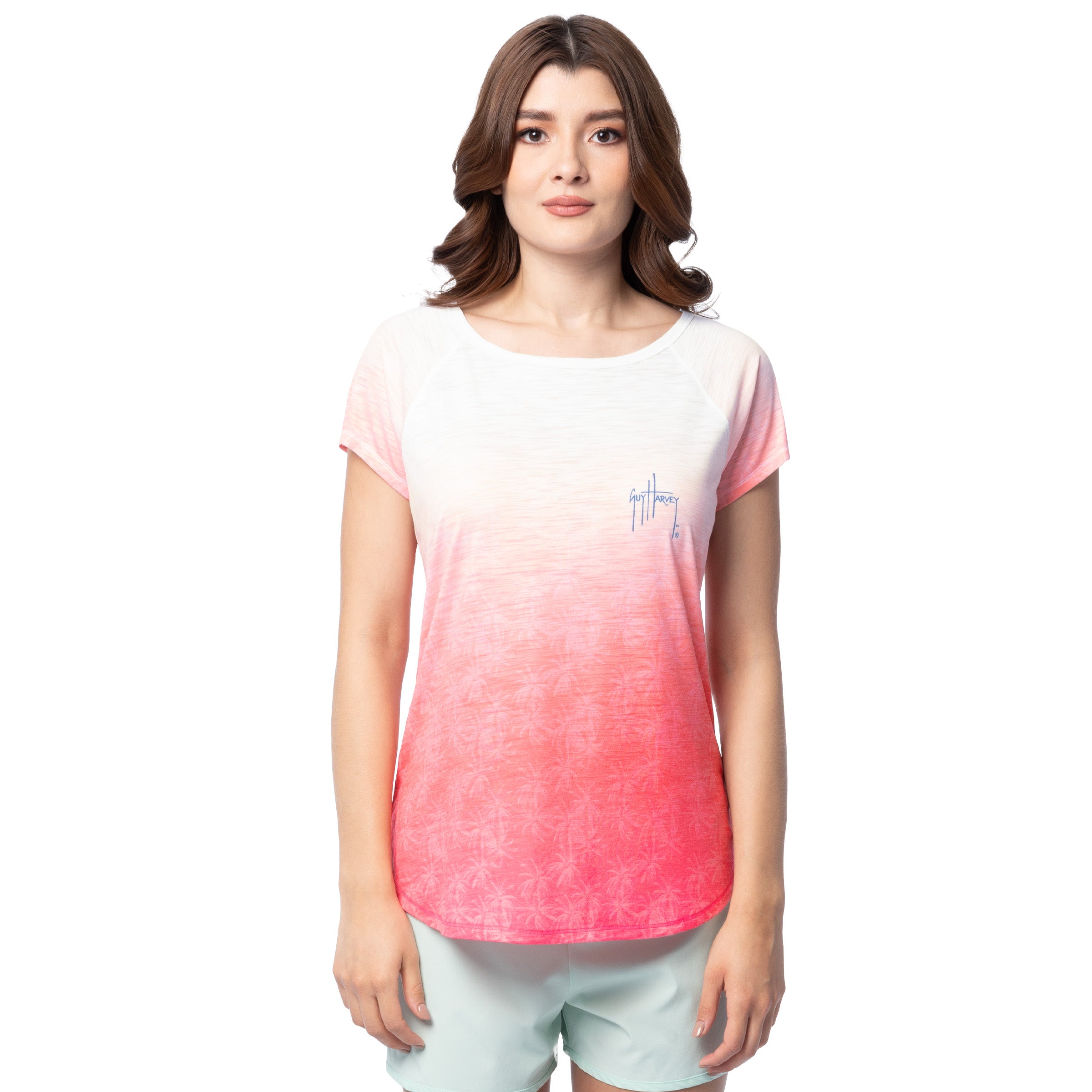 Woman wearing a pink and white gradient Guy Harvey t-shirt on a white background