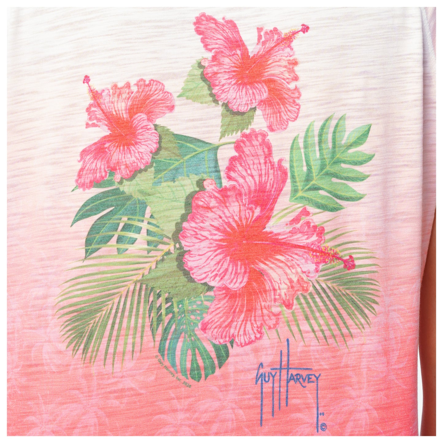 Shirt with pink floral design and Guy Harvey signature on a white background