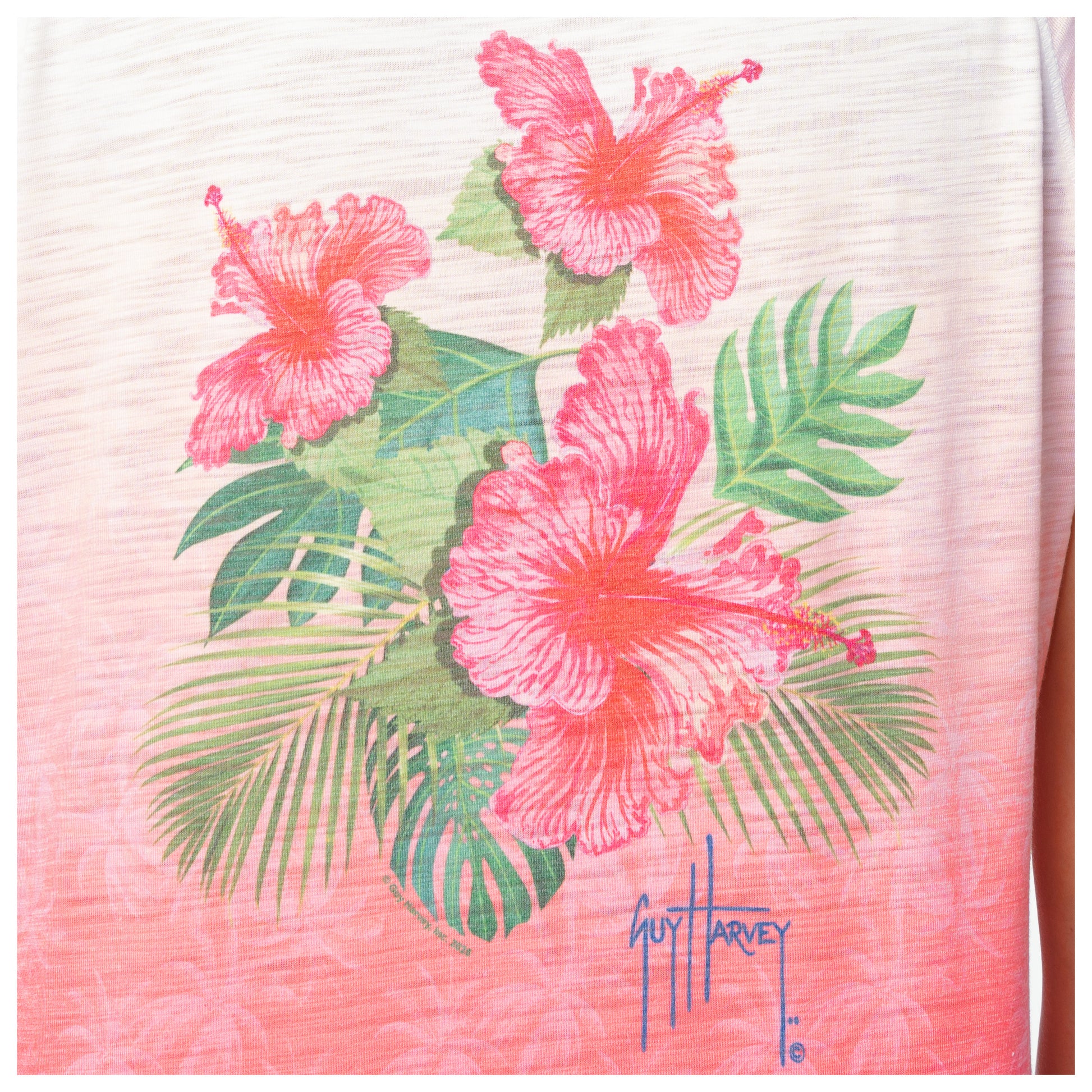 Shirt with pink floral design and Guy Harvey signature on a white background