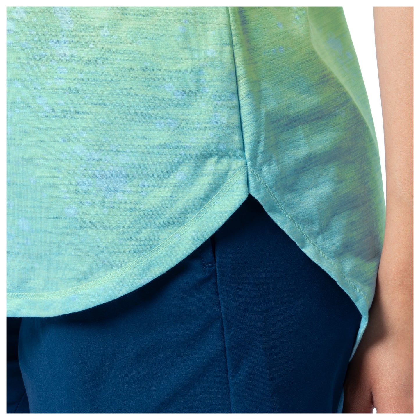 Green and blue patterned top with a plain background