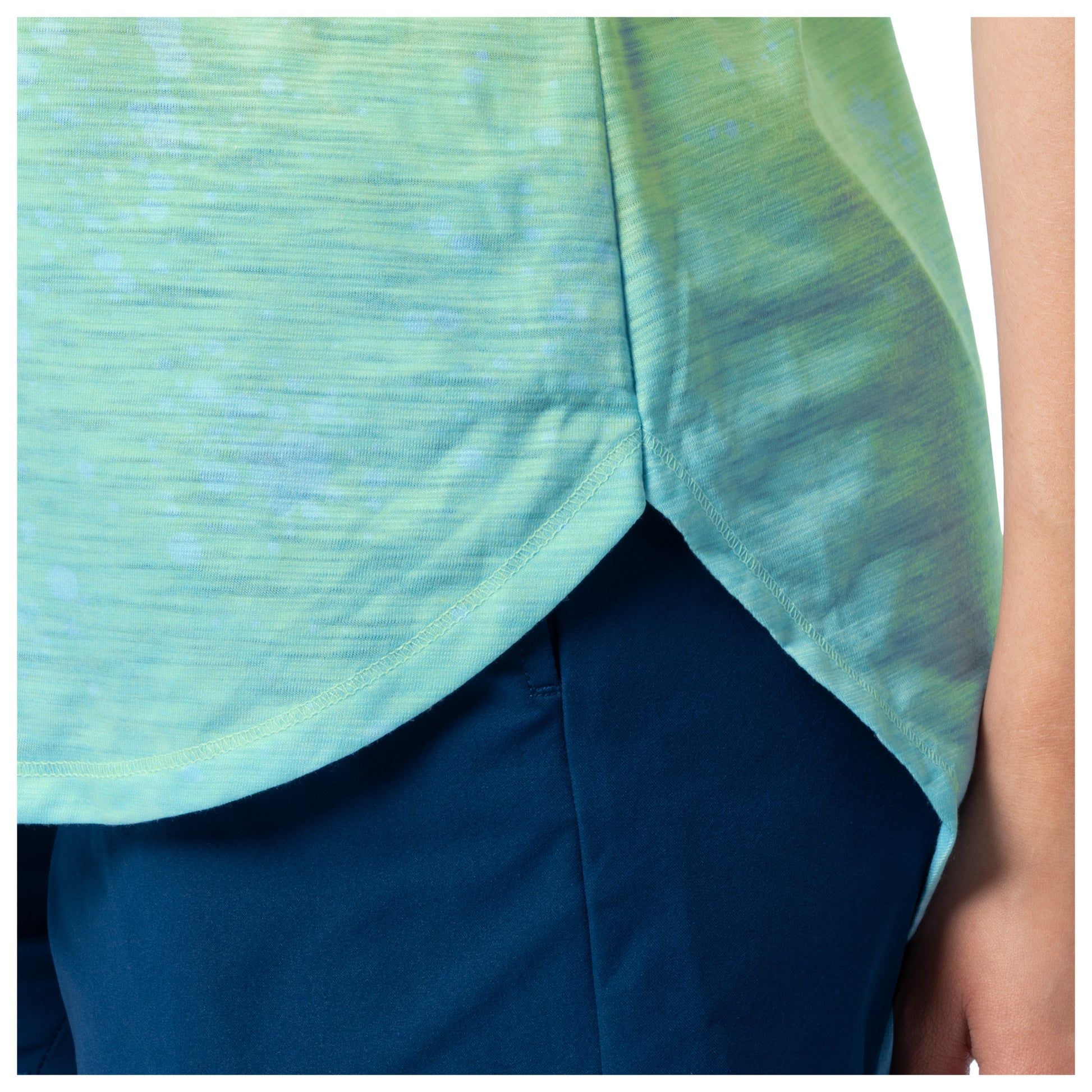 Green and blue patterned top with a plain background