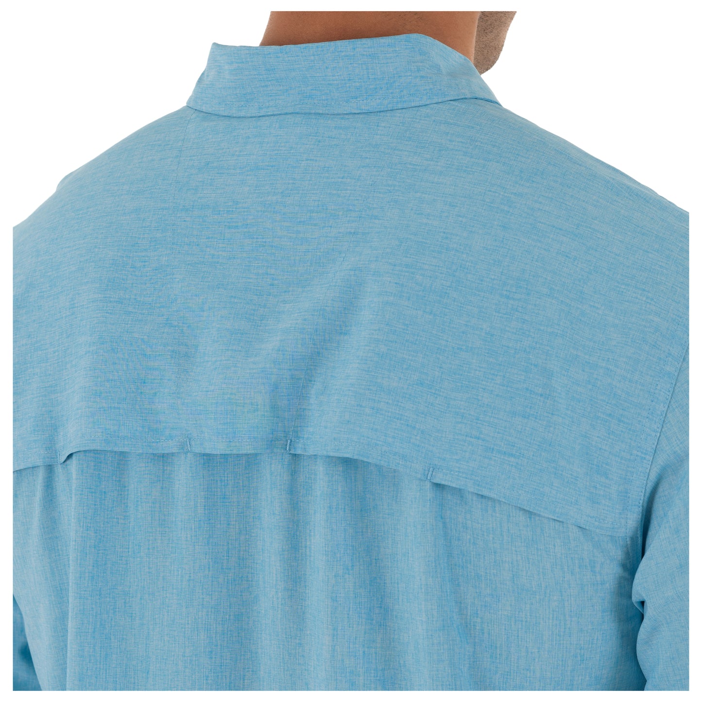 Close-up of a blue shirt with a collar and pocket on a white background