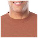Close-up of a person wearing a brown shirt with a visible collar.