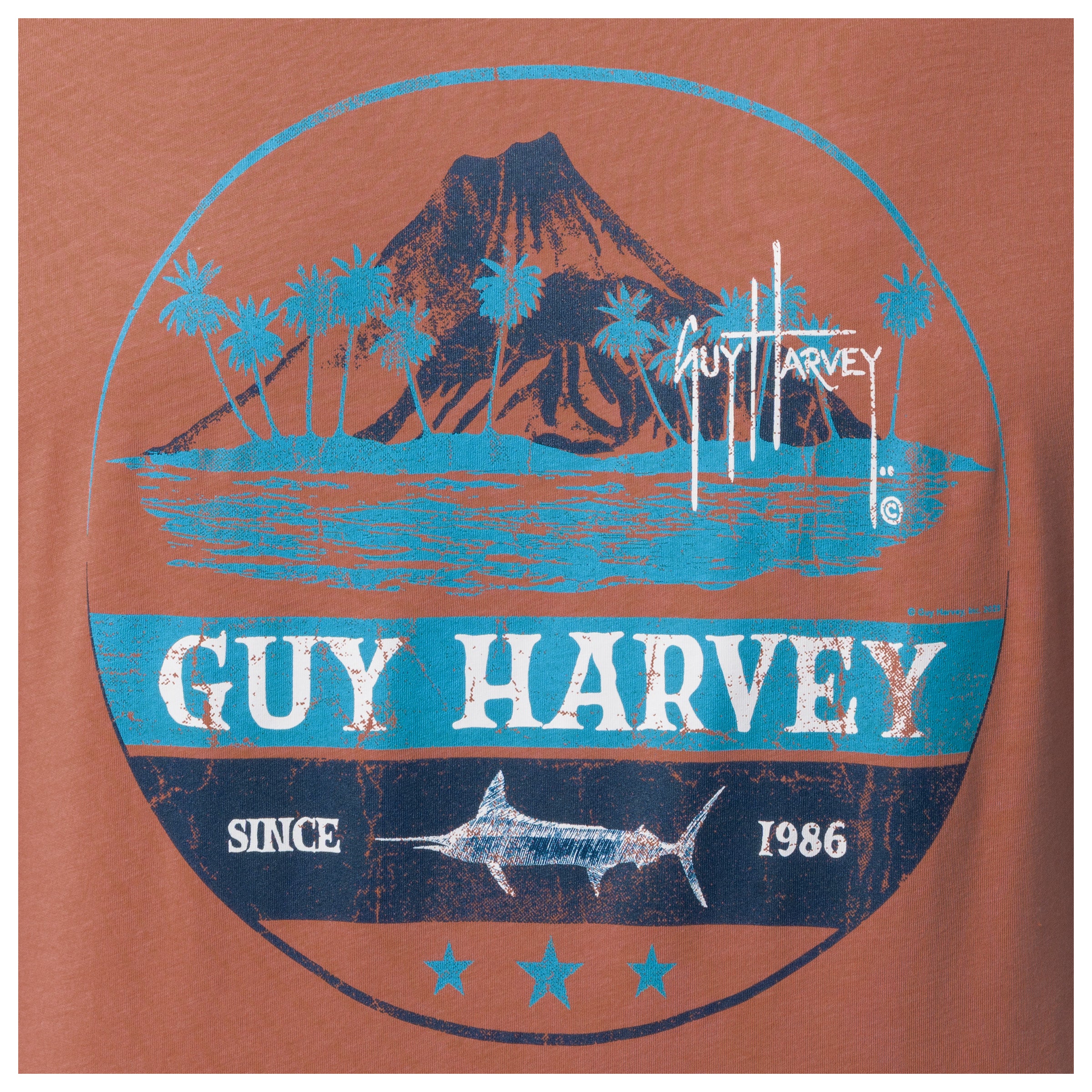 Guy Harvey logo on a brown background with Volcano, palm trees, and fish design.