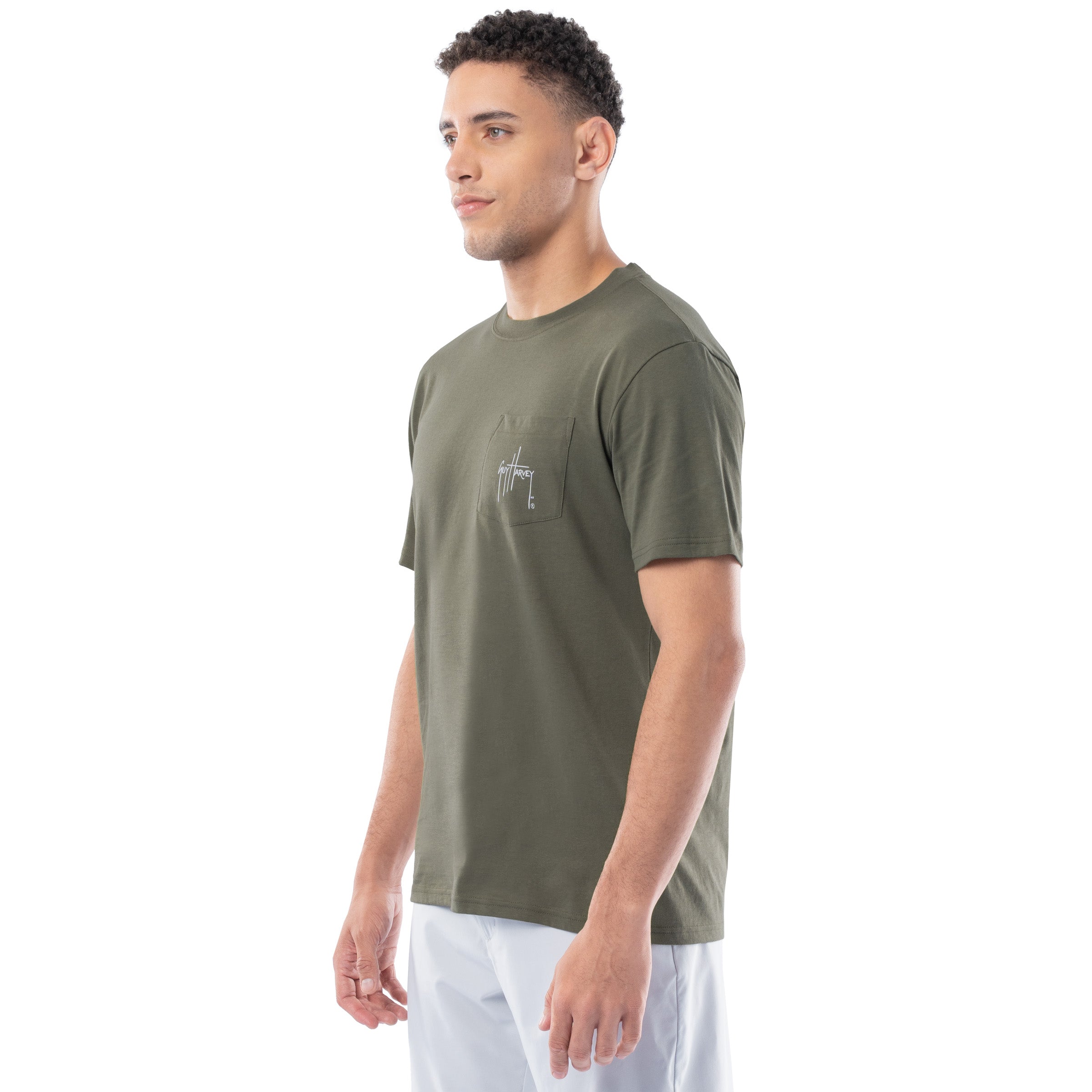 Man wearing a green t-shirt with a logo on a white background