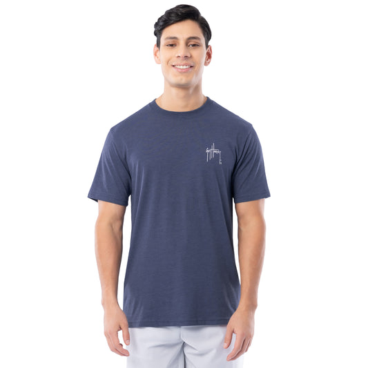 Man wearing a navy blue t-shirt with a Guy Harvey logo on a white background