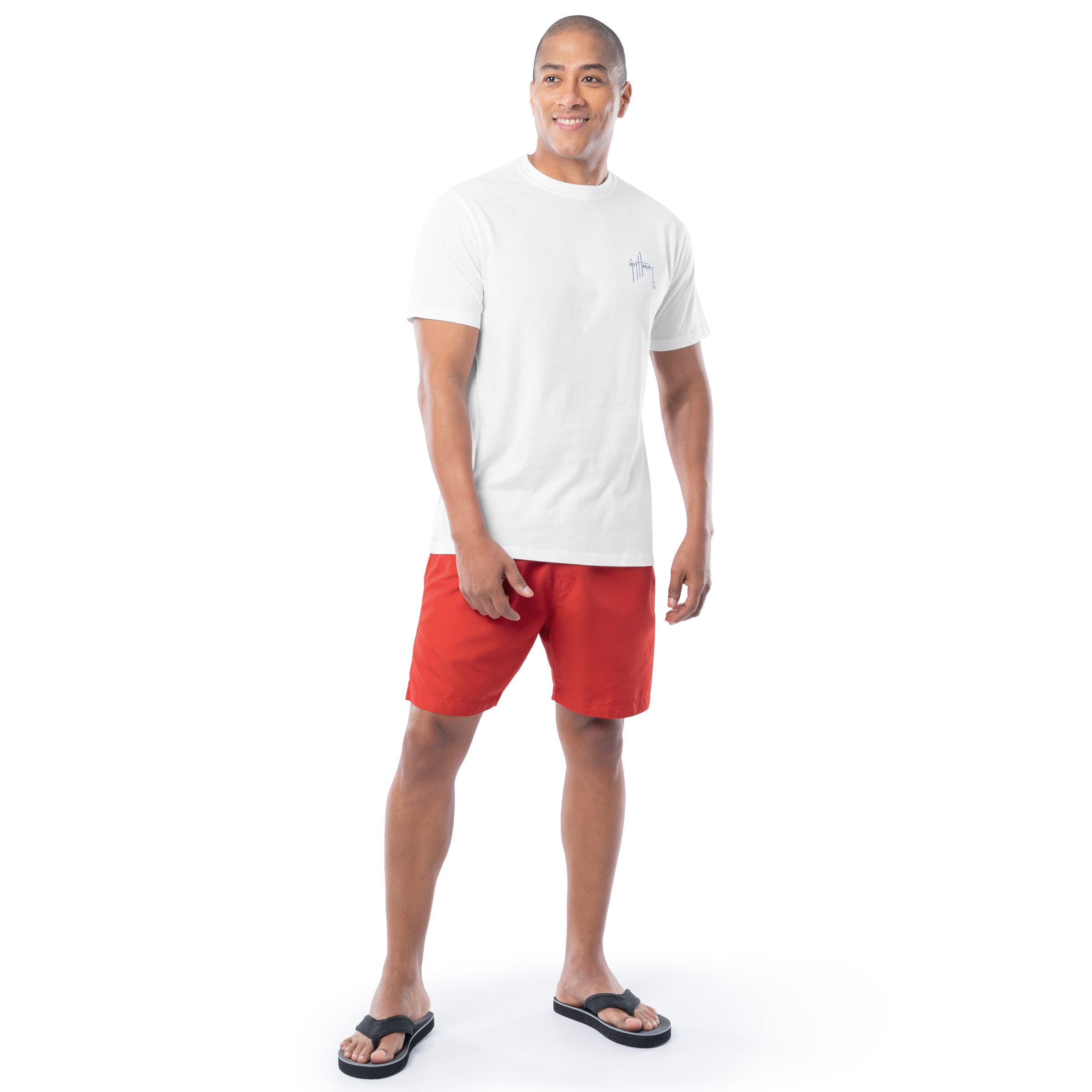 Man wearing a white t-shirt and red shorts on a white background