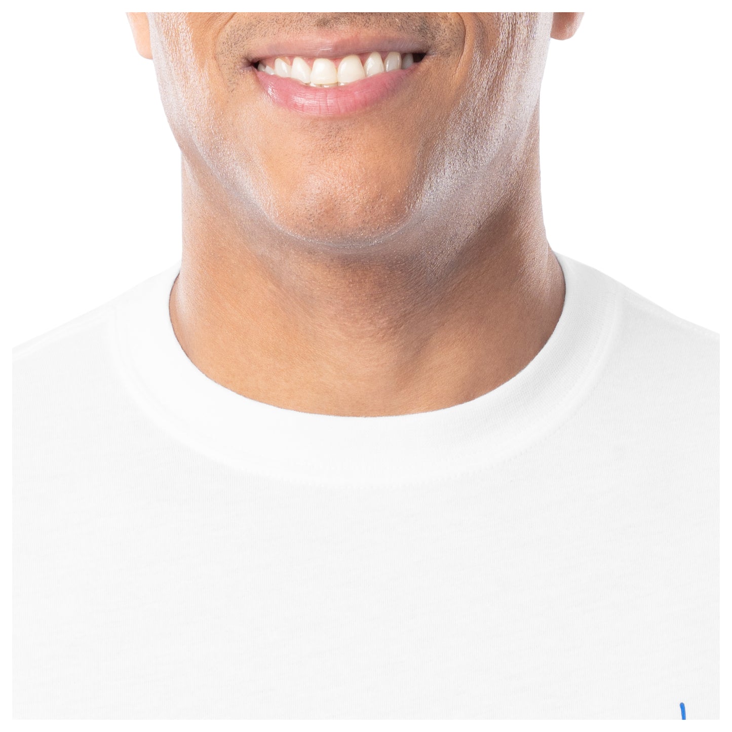 Close-up of a person wearing a white shirt with a plain background