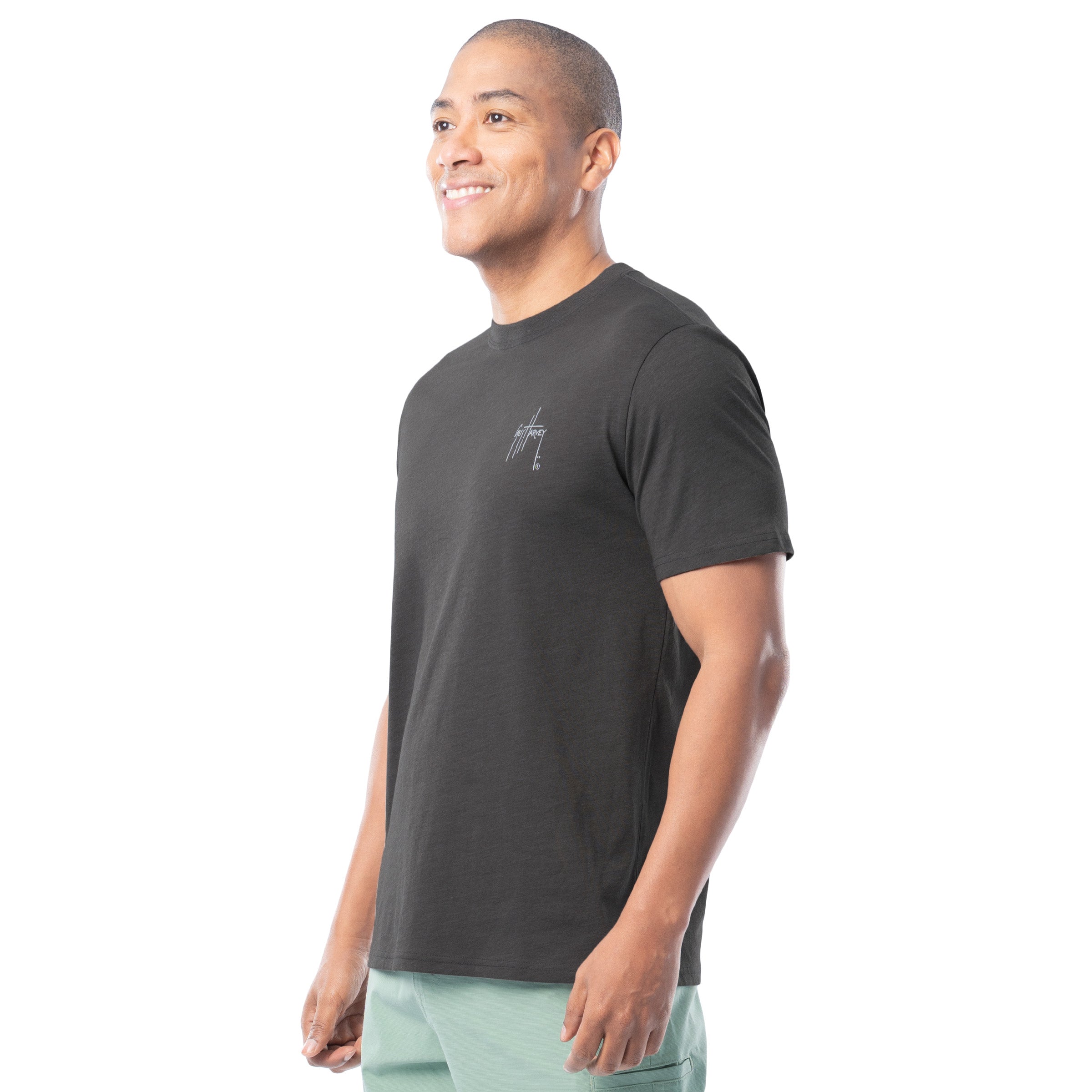 Man wearing a black t-shirt with a logo on a white background