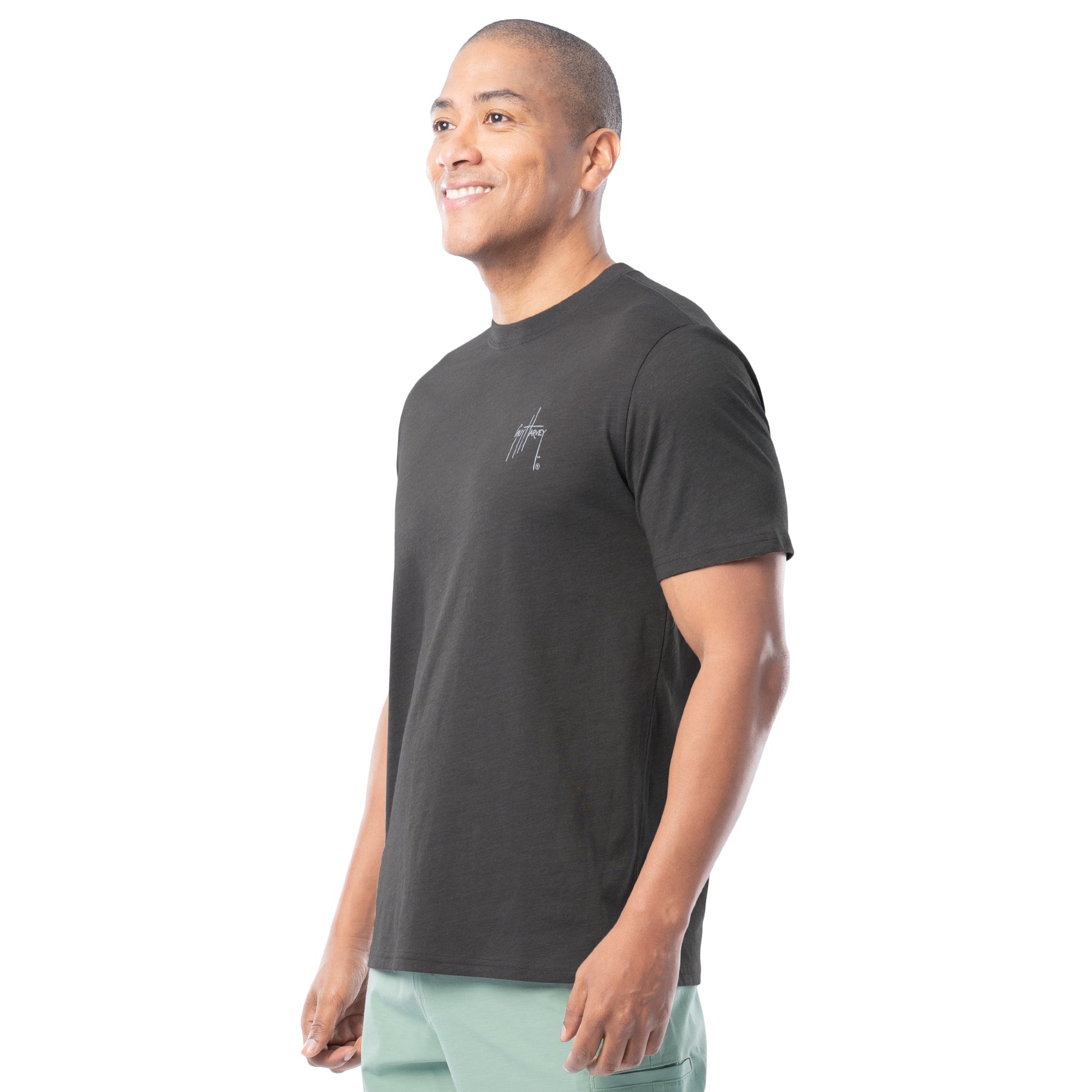 Man wearing a black t-shirt with a logo on a white background