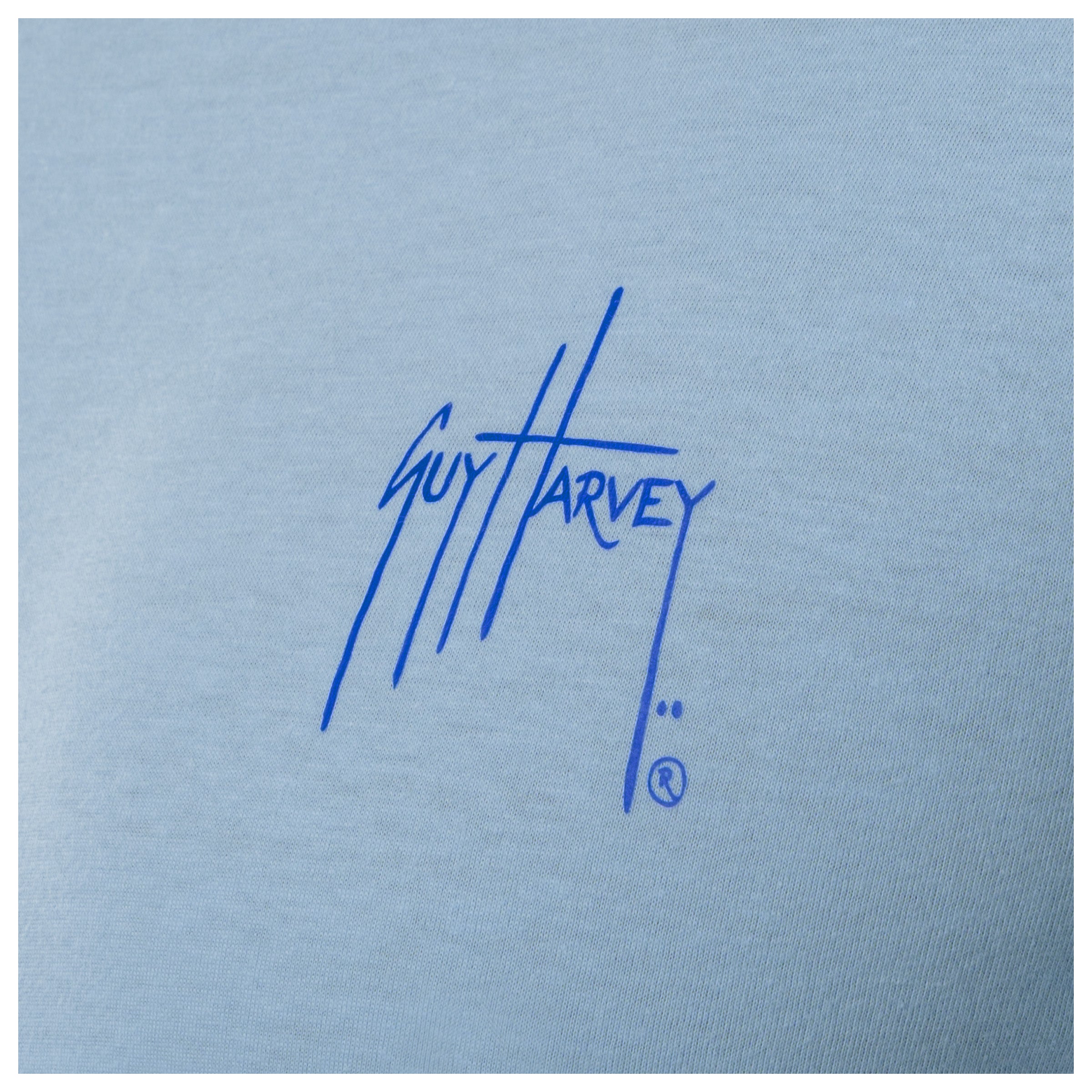 Blue Guy Harvey logo on a light blue background