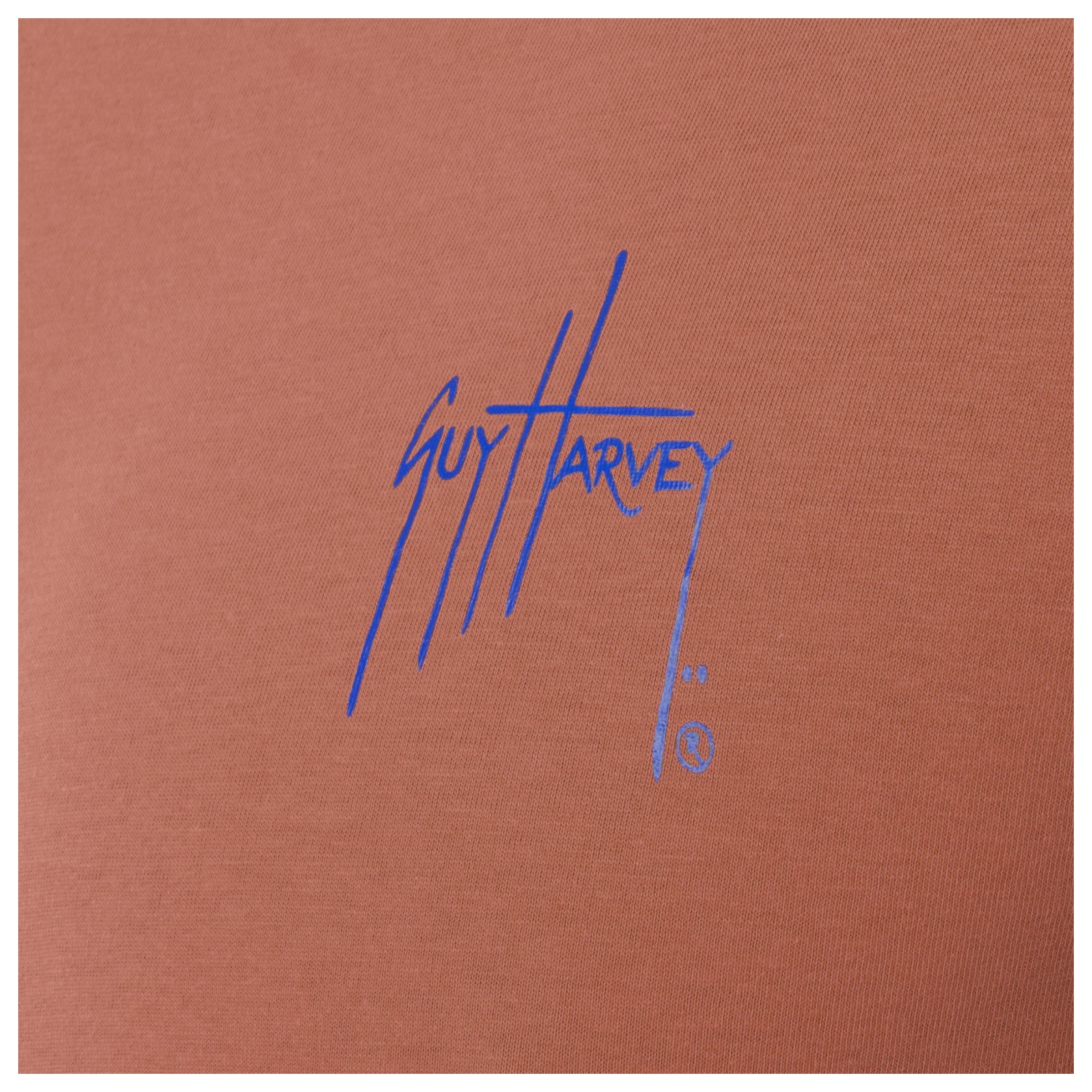 Blue Guy Harvey logo on a orange background