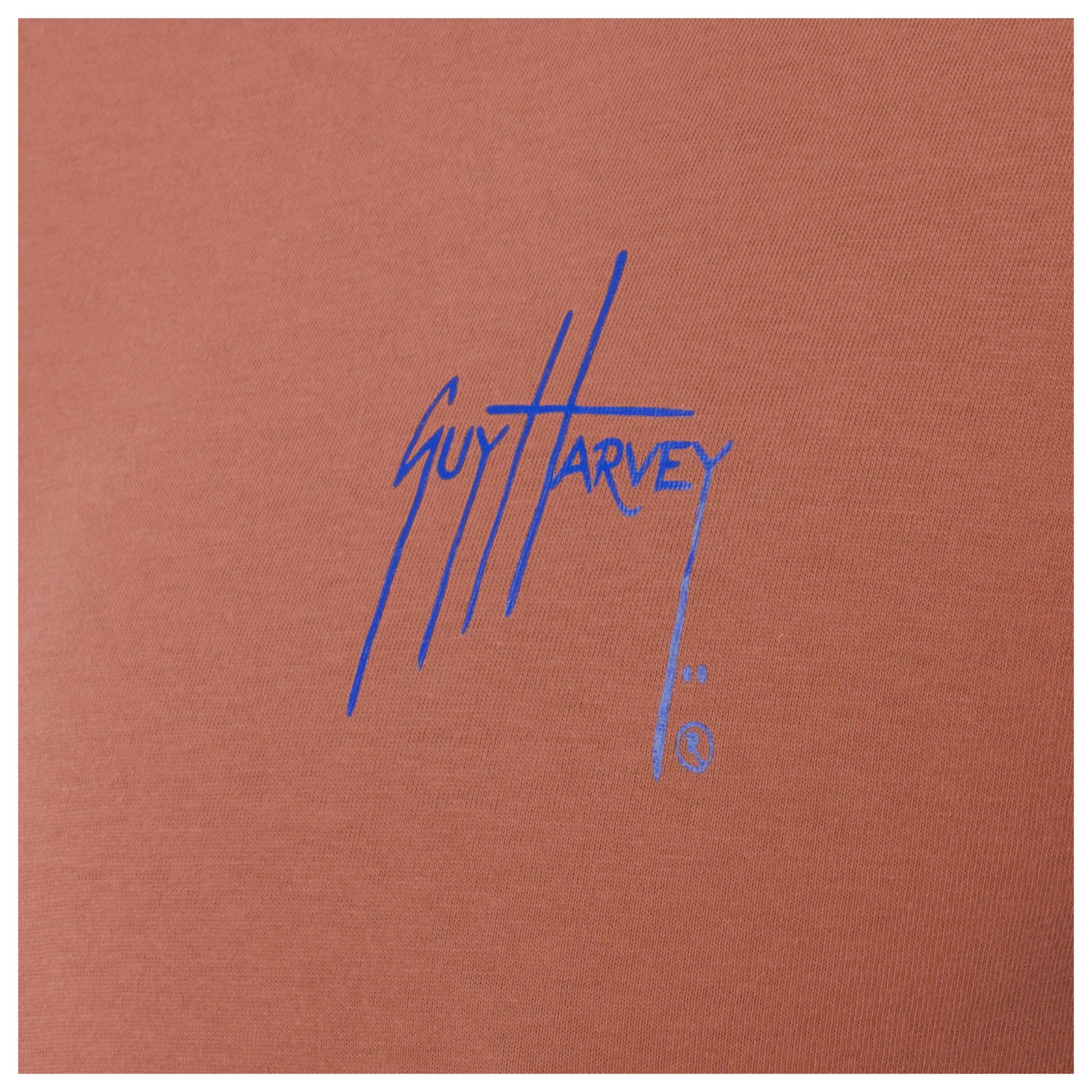 Blue Guy Harvey logo on a orange background