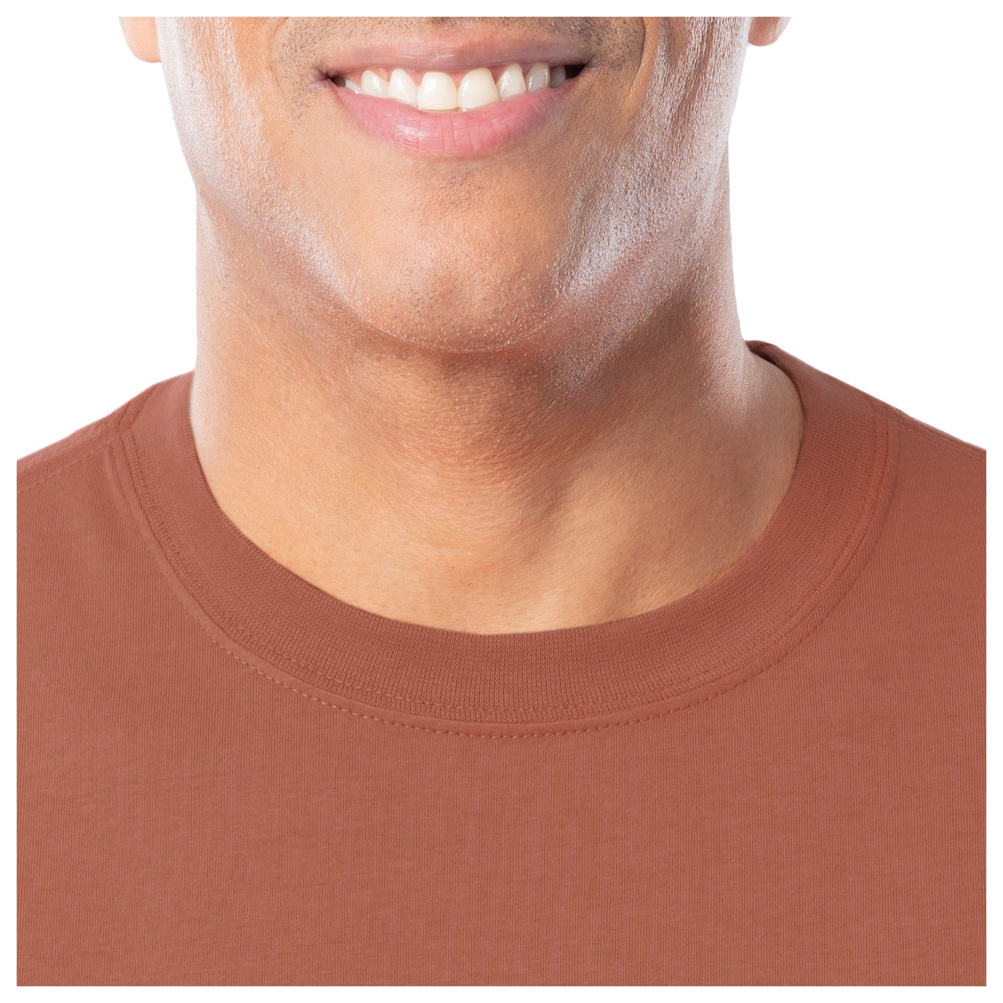 Close-up of a person wearing a orange shirt with a white background.