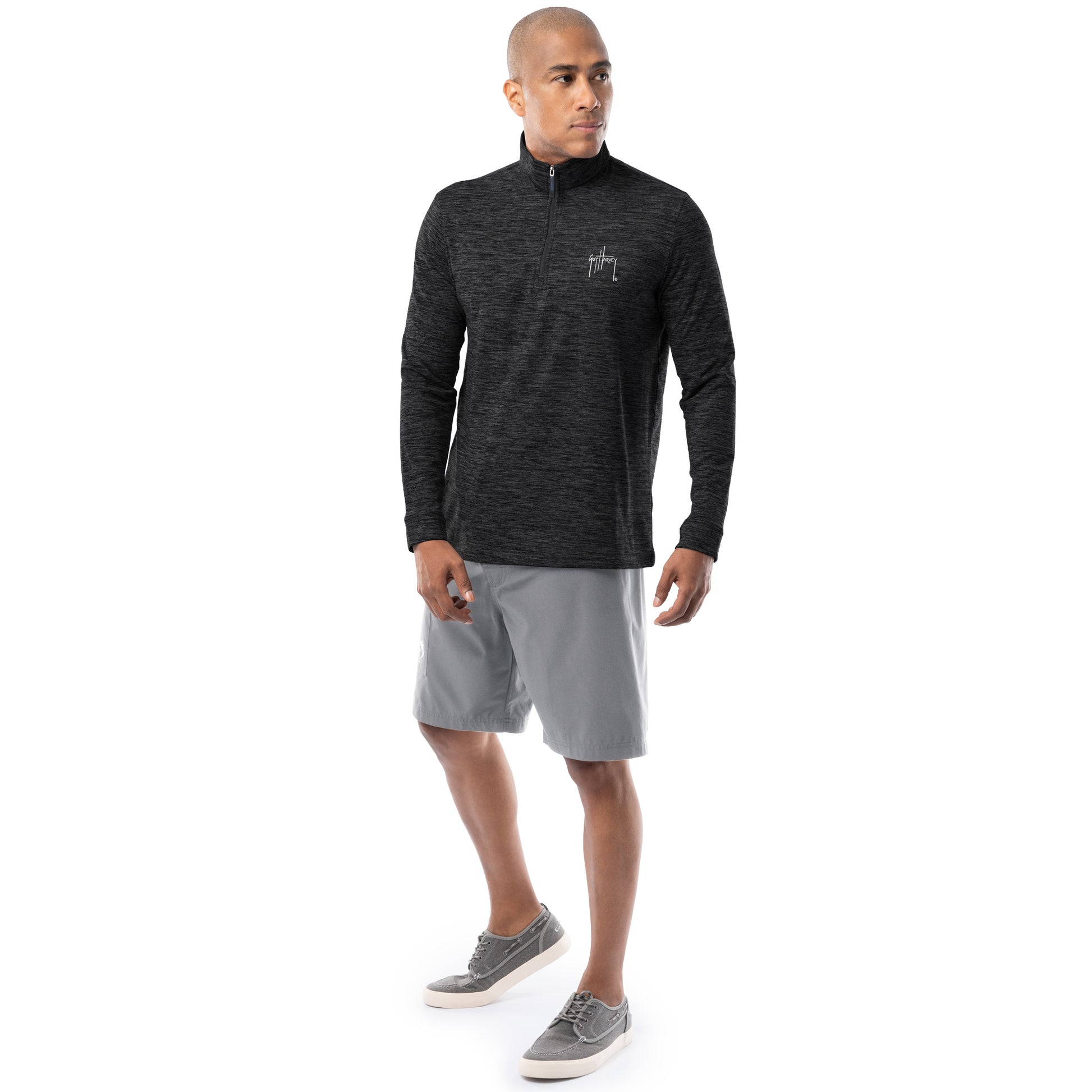 Guy Harvey men’s black fleece quarter zip pullover styled with gray shorts, full-body view