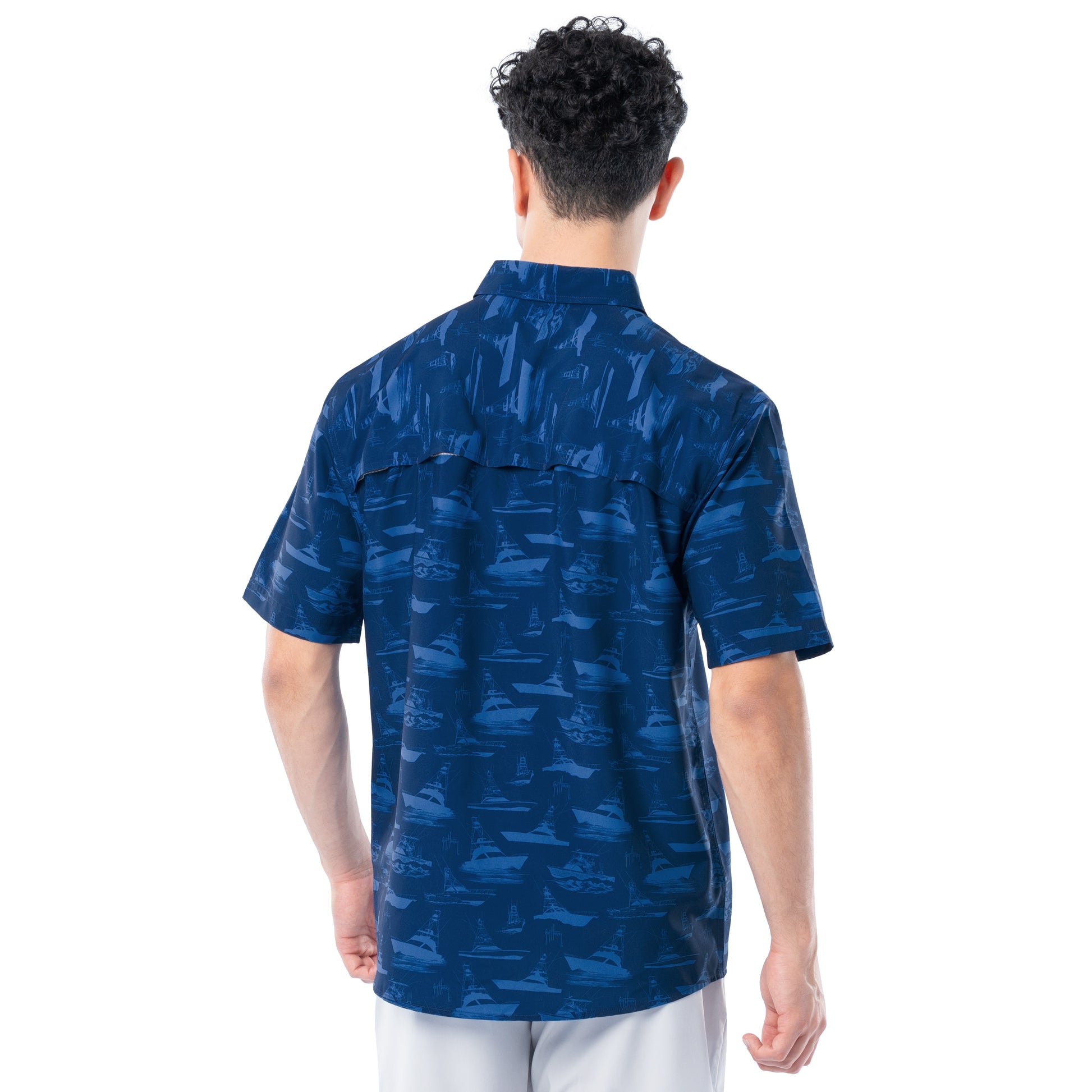 Person wearing a blue patterned shirt on a white background