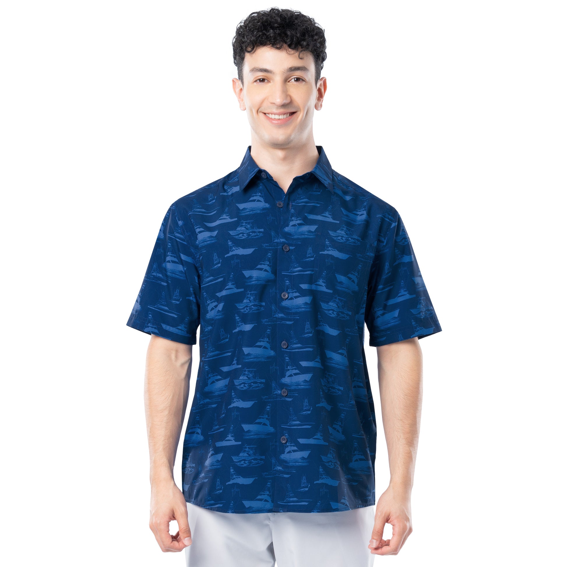 Man wearing navy Men’s Boat Sketch short-sleeve performance fishing shirt with boat print, UPF 40, and ventilated back.