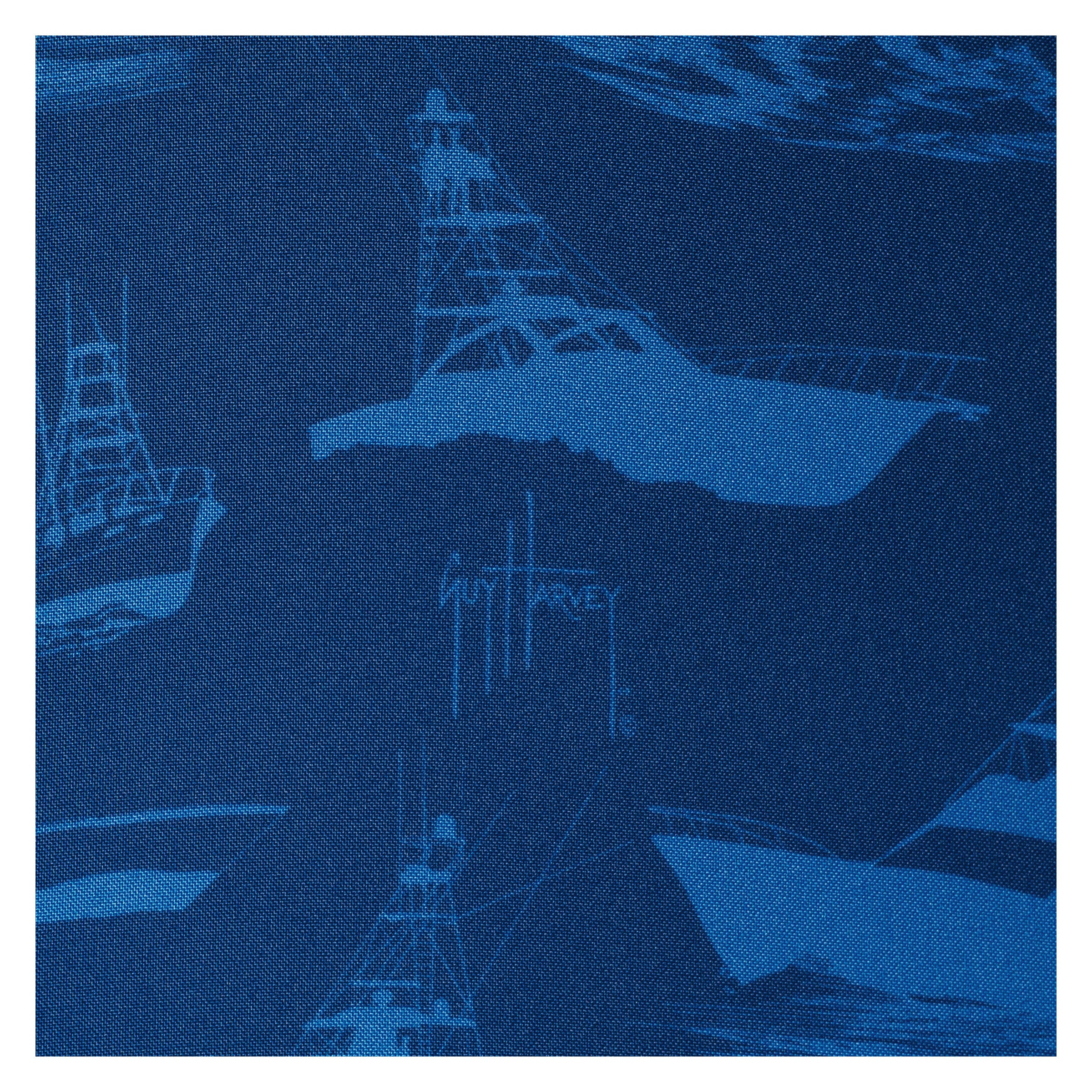 Blue fabric pattern with ship silhouettes and 'Guy Harvey' branding.