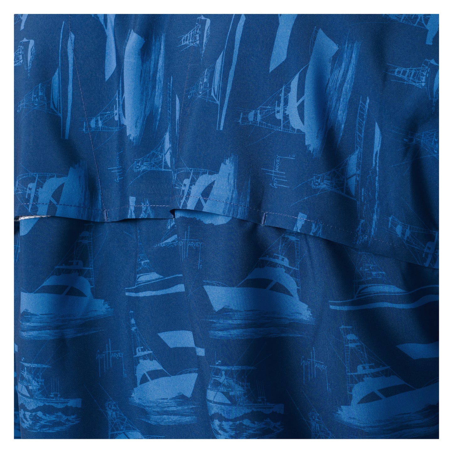 Ventilated back of the blue shirt with the printed boat design